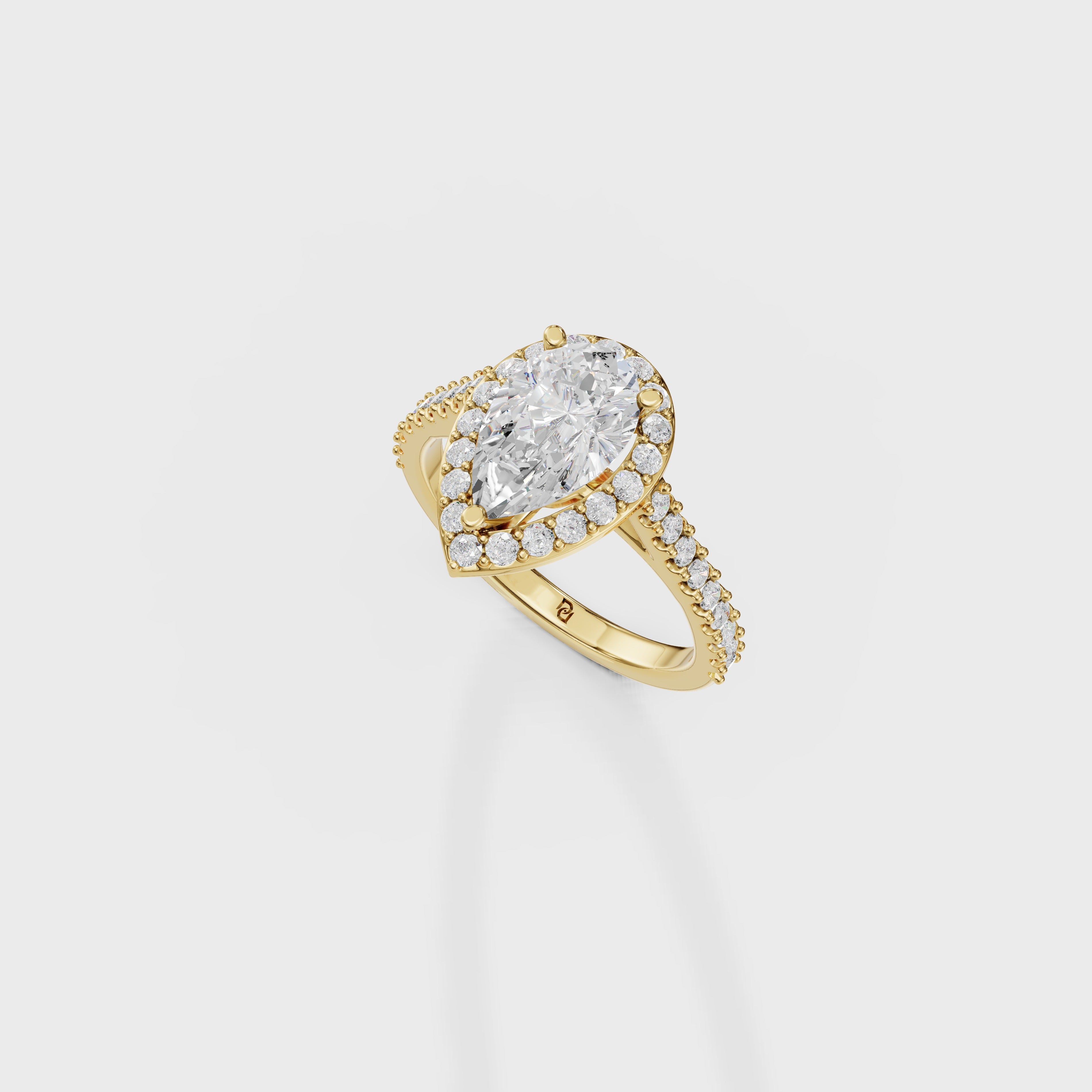 Blushing Halo Pear Diamond Ring