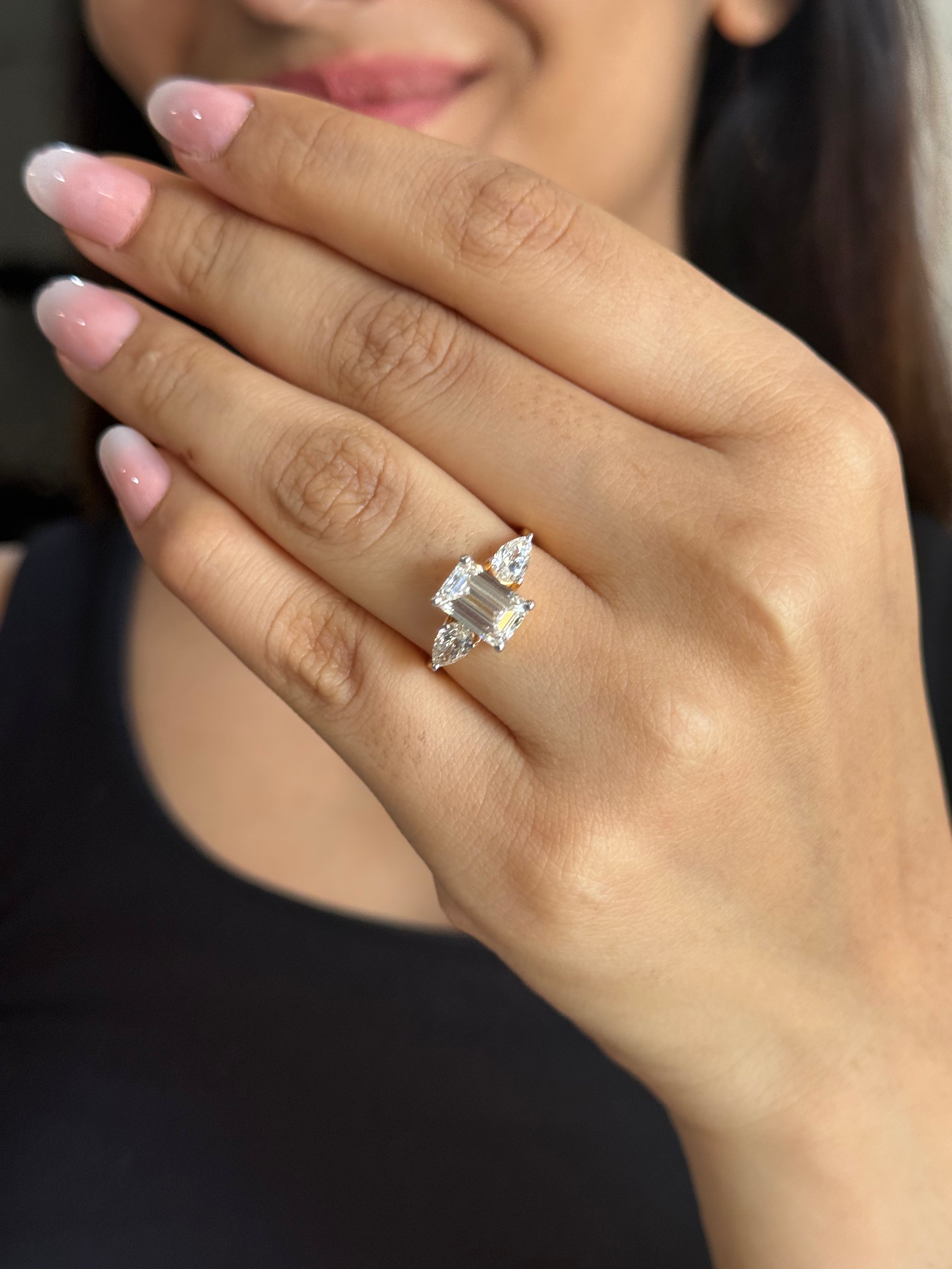 Emerald & pear cut three stone ring