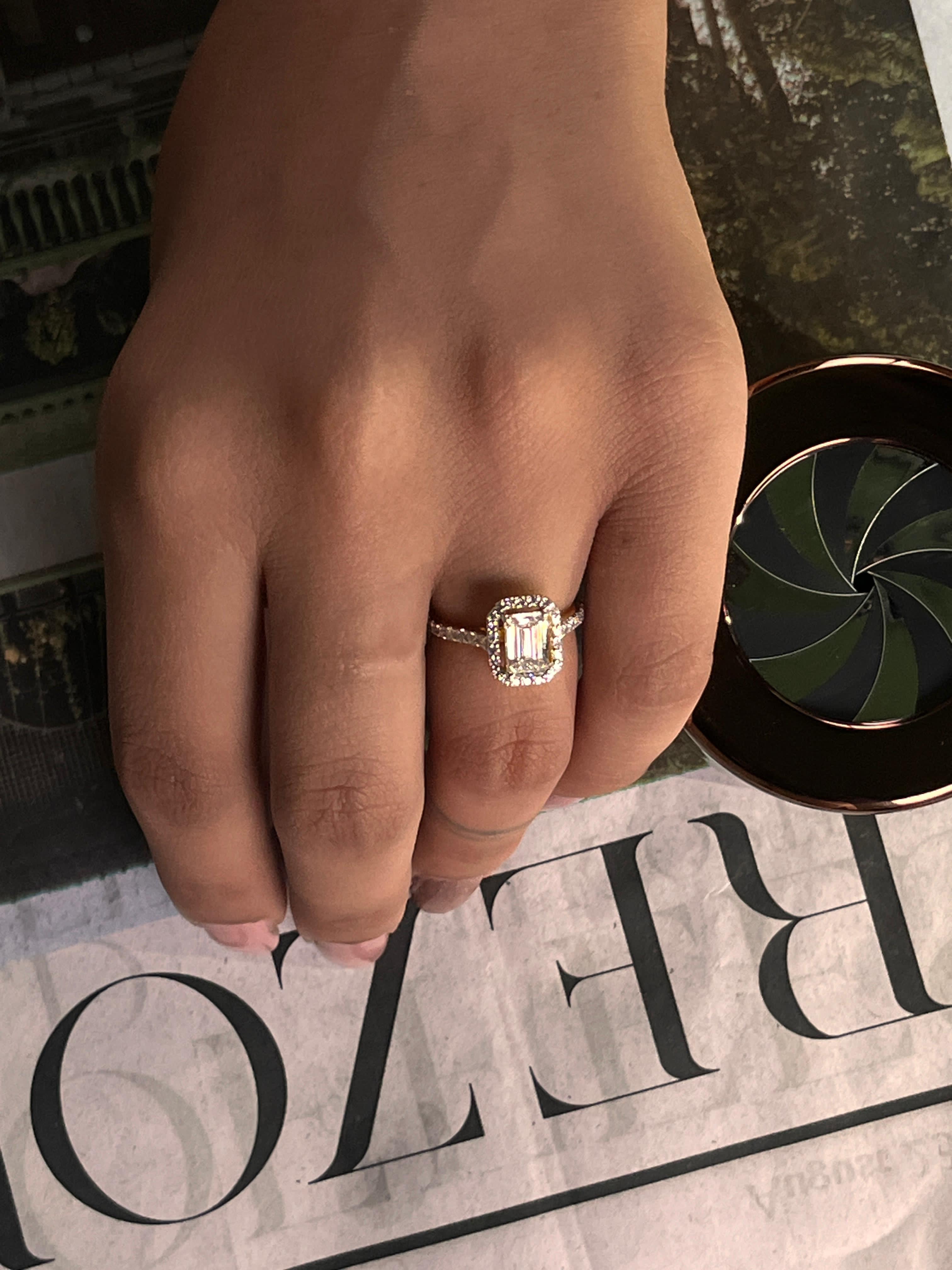 Emerald Cut Diamond Halo Engagement Ring with Pave Band