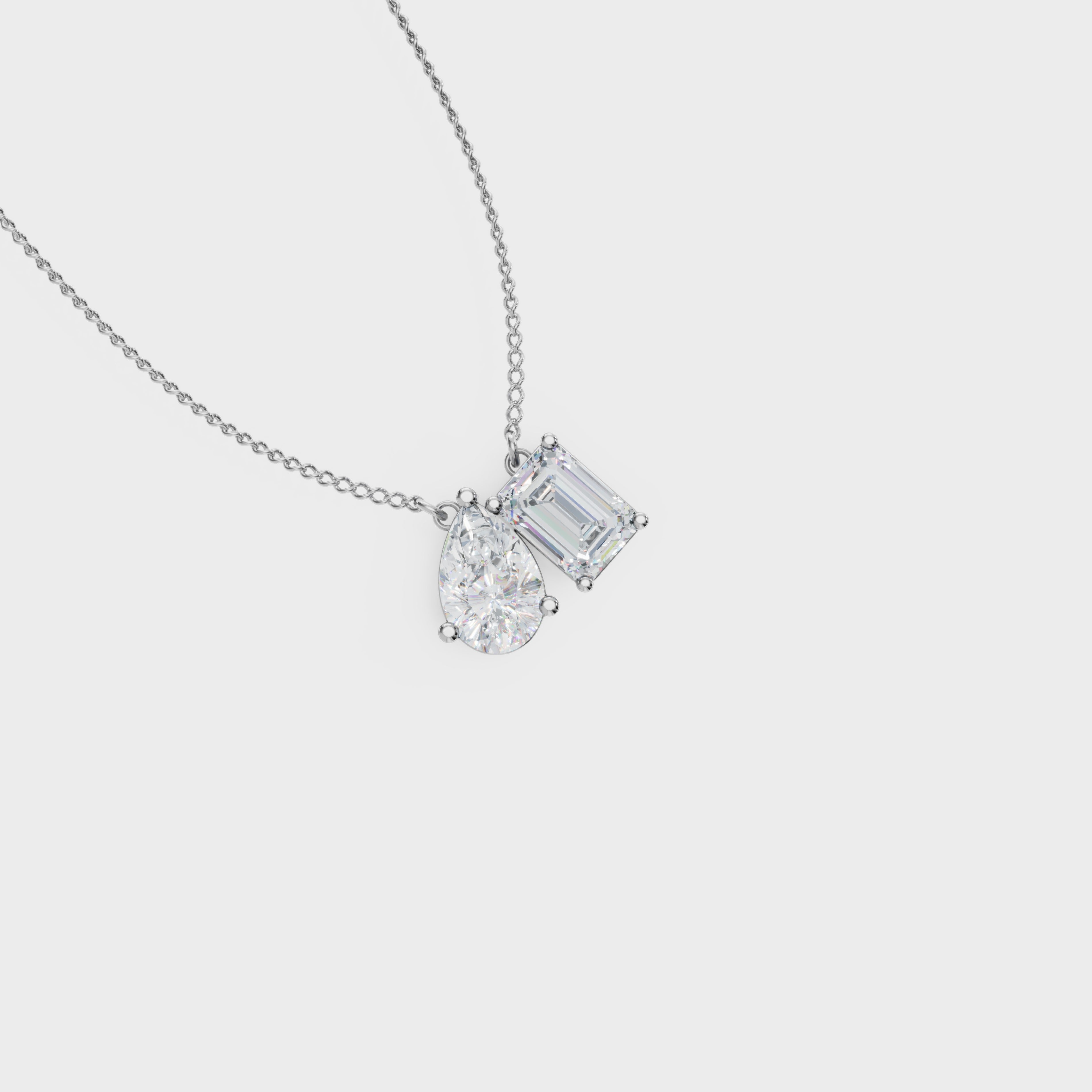 Symphony Emerald And Pear Cut Diamond Pendant