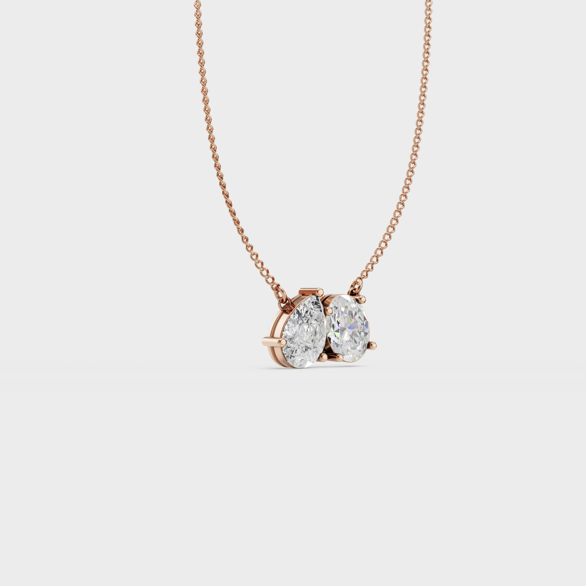 Twin flame oval and pear pendant
