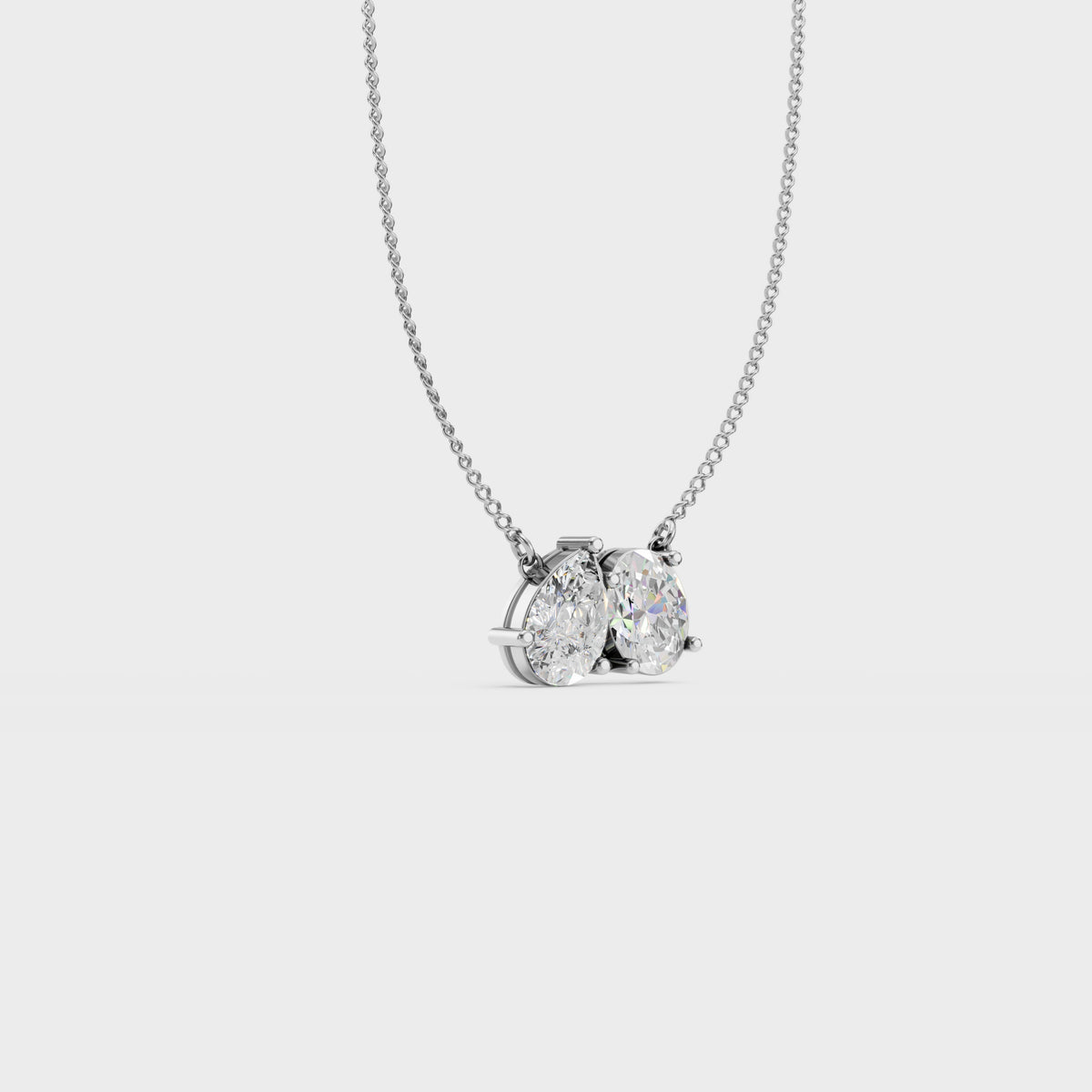 Twin flame oval and pear pendant