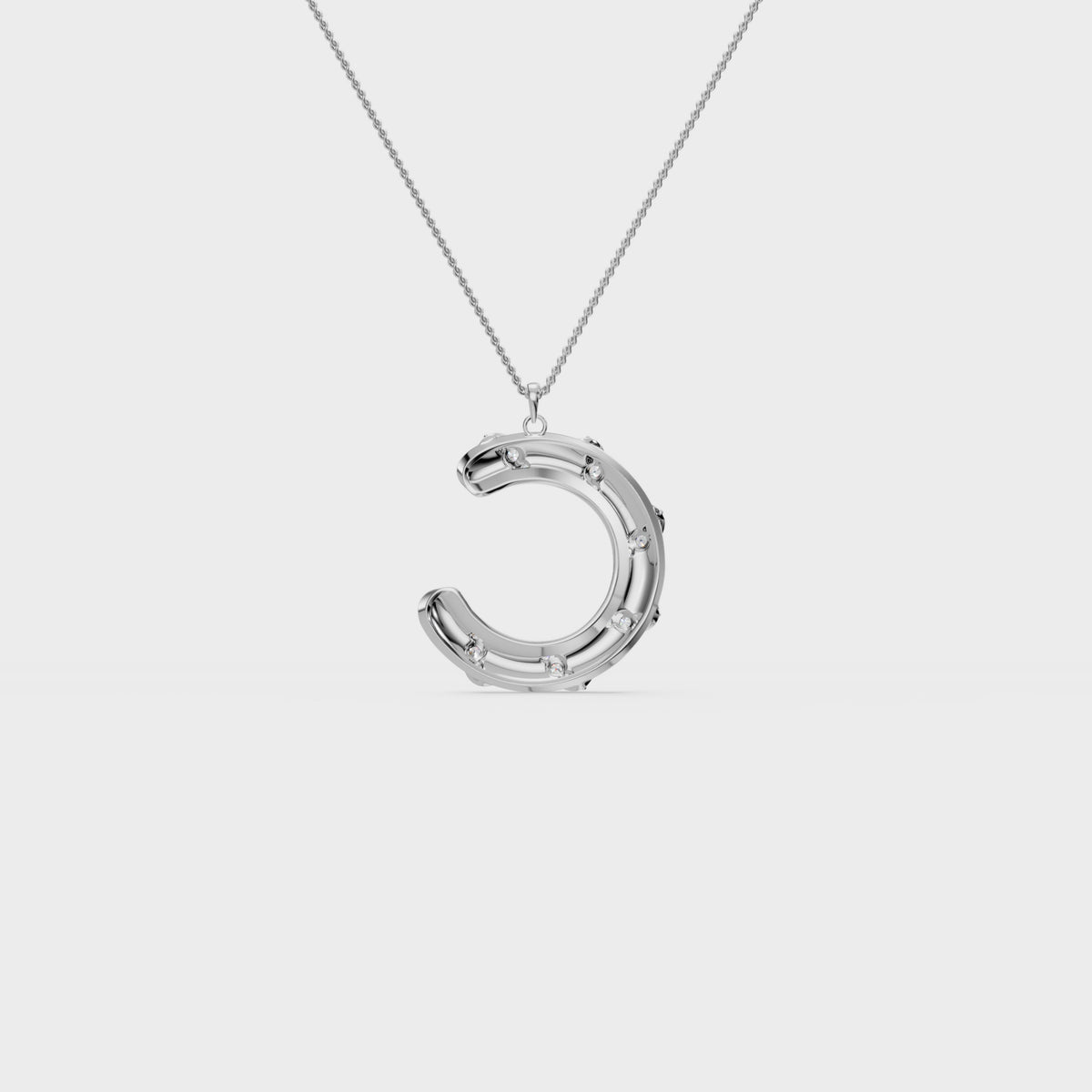 Monogram C diamond swirl pendant