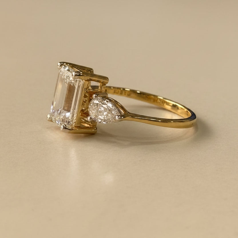 Emerald & pear cut three stone ring
