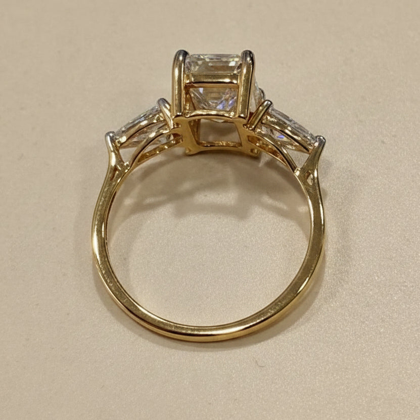 Emerald & pear cut three stone ring