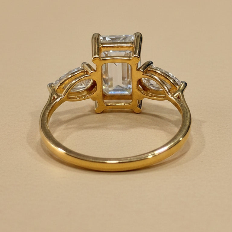 Emerald & pear cut three stone ring