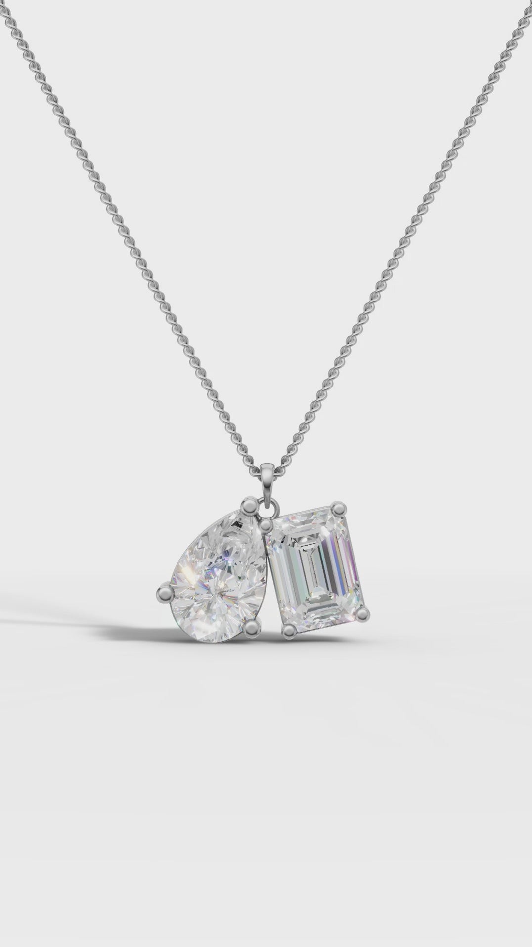Symphony Emerald And Pear Cut Diamond Pendant